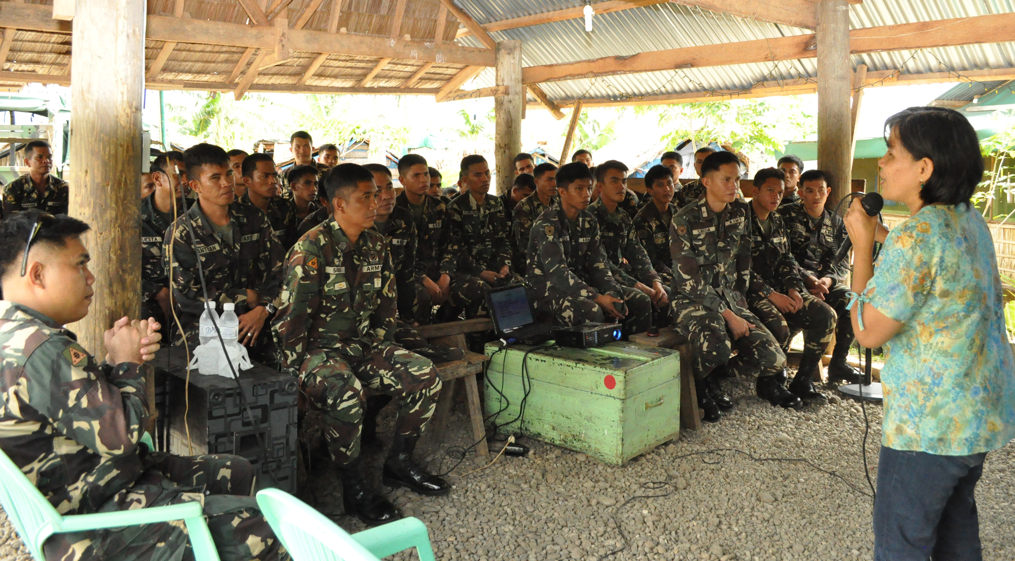 Asst. Prof. Lilian B. Nuñez explaining the topic on gender and development to some military personnel based in Sitio Wangag, Damulaan, Albuera, Leyte. vsu-conducts-GAG-forum